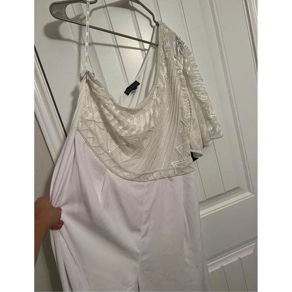 One shoulder white jumpsuit from Eloquii.
Size 18
Beaded detail on top.
Purchase - Picture 4 of 11